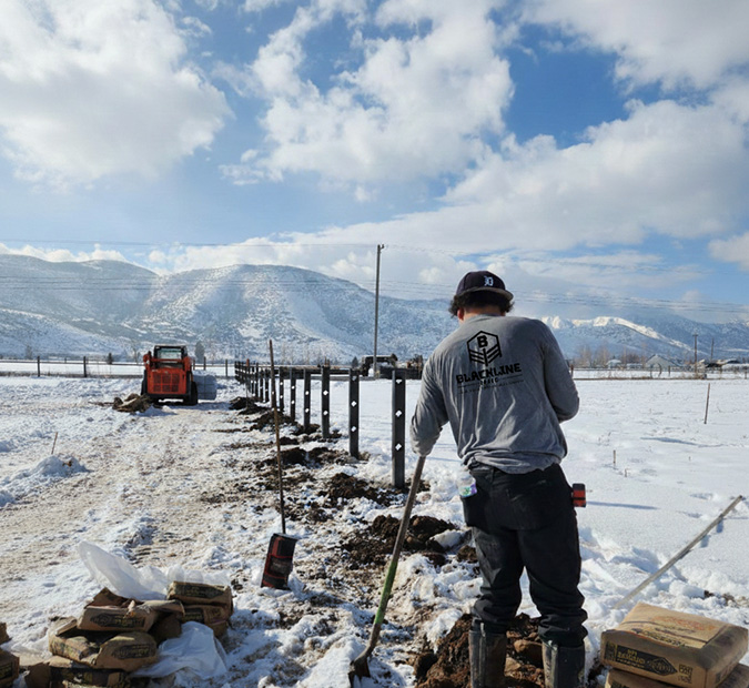 Detailed view of 2 rail black vinyl fence
