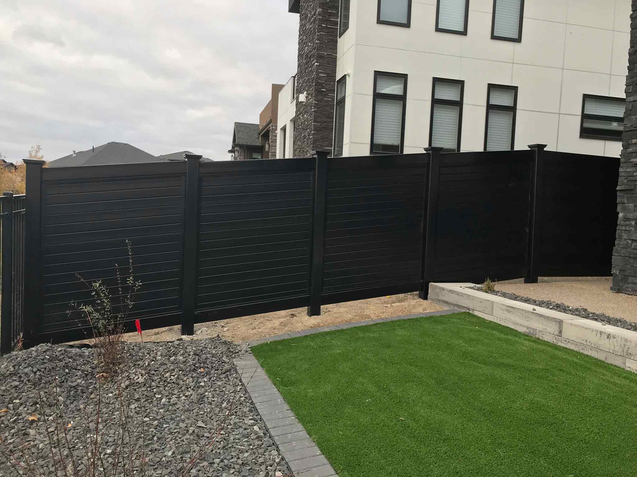 Residential horizontal solid vinyl fence residential buildings