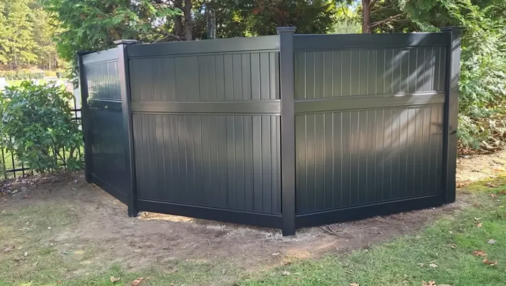 upgrading the backyard with black vinyl privacy fence