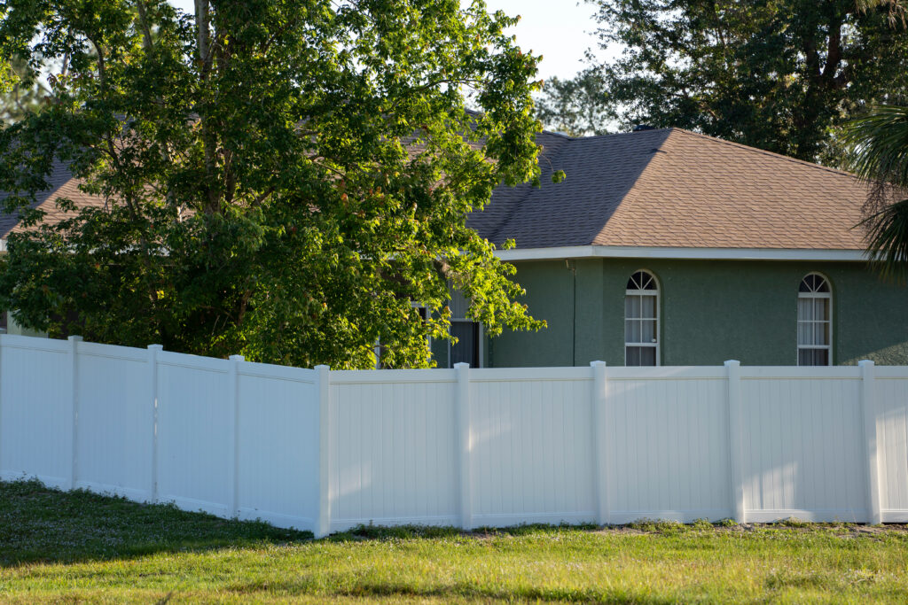 White plastic fence for back yard protection and privacy