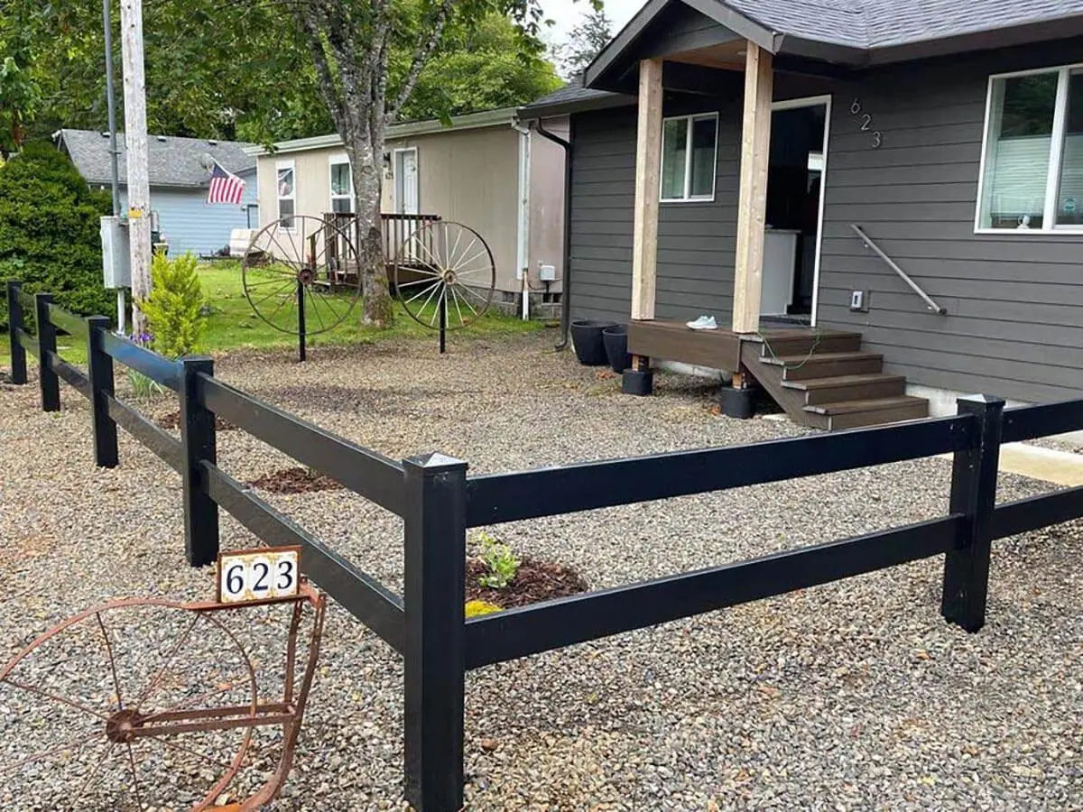 2 rail vinyl ranch fence installed around the front of a home
