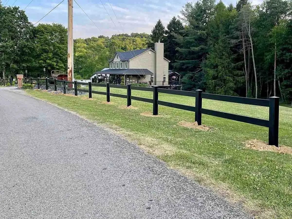 BLACKline HHP 2-rail vinyl ranch fence installed along a road
