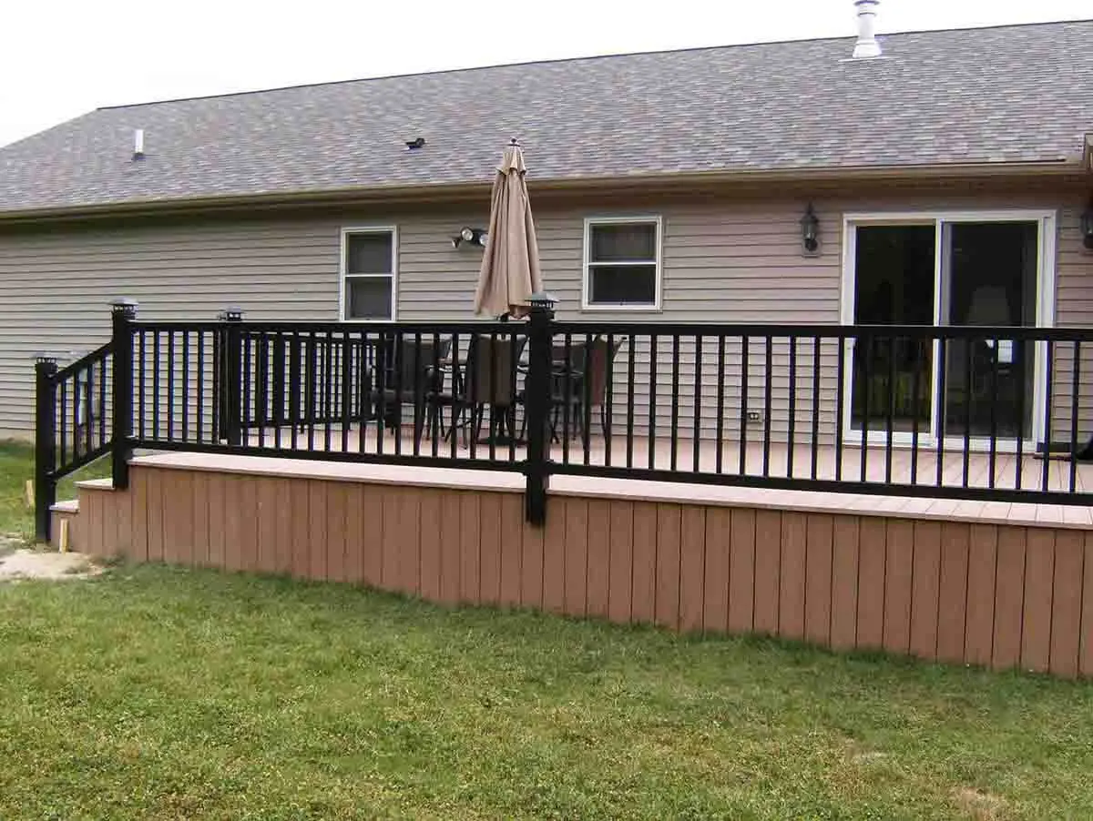 Residential 2 rail vinyl railings with lighted posts installed around the edge of a patio